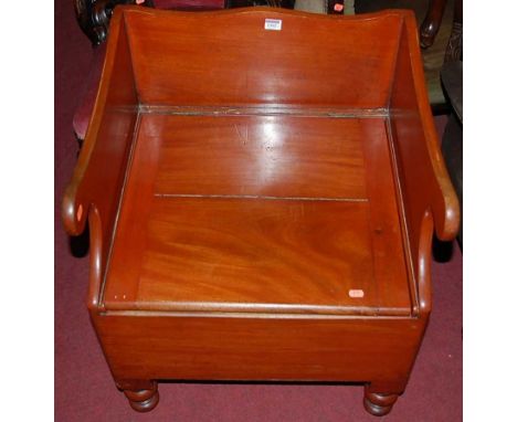 A Victorian mahogany hinged panelled seat commode chair on turned supports, width 57cm