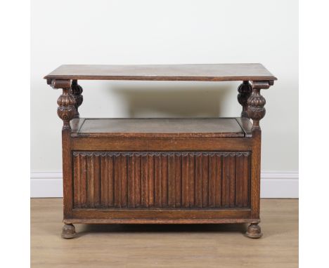 A 17TH CENTURY STYLE OAK MONK'S BENCHWith linen fold front panel, 108cm wide; 53cm deep; 79cm high