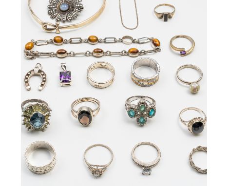 A GROUP OF SILVER JEWELLERY (20)Including 13 rings, some set with various gemstones, two neck chains, a tigers eye bracelet, 