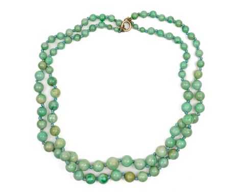 A TWO ROW NECKLACE OF GRADUATED JADE BEADSOn a gilt metal bolt ring clasp, length 41.5cm, gross weight 68.1grms