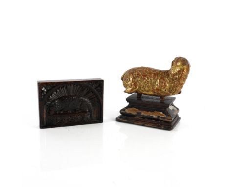 A EUROPEAN CARVED GILTWOOD AGNUS DEI OR LAMB OF GOD TOGETHER WITH A CARVED OAK PANEL (2)Possibly 18th Century 
The first recu