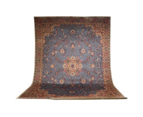 A  LARGE MACHINE WOVEN CARPETOf paisley design with blue ground and pink flowers, modern, 318 x 407cmCondition: Fair to good;