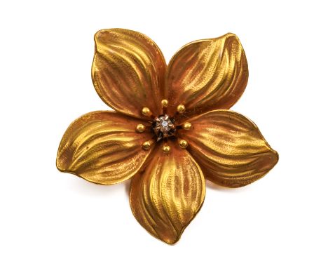 A GOLD AND DIAMOND FLOWER HEAD BROOCHClaw set with a central old cut cushion shaped diamond, detailed 10 K, width 26mm, gross