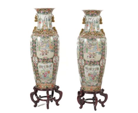 A PAIR OF CHINESE GILT-HEIGHTENED FAMILLE ROSE DECORATED LARGE BALUSTER VASES ON STANDS (4)Modern
Decorated with cartouches d