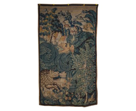 A NORTH EUROPEAN VERDURE TAPESTRY SECTION DEPICTING A WILD BOAR HUNTLate 17th / 18th Century 
Dogs attacking a wild boar with