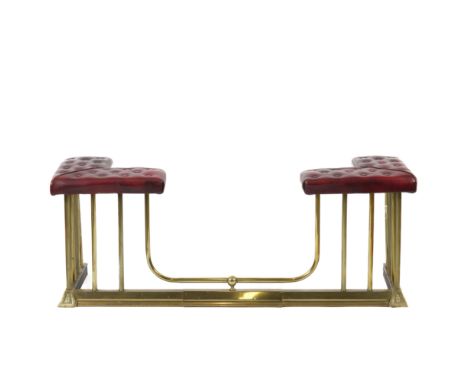 A BRASS AND BUTTON DOWN RED LEATHER CLUB FENDERSecond half 20th Centuy
With alternating fluted and plain uprights, adjustable