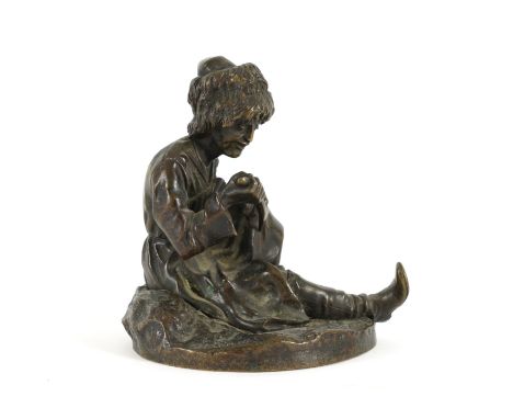 VASSILI YACOVLEVITCH GRACHEV, RUSSIAN (1831-1905): A BRONZE FIGURE OF A SEATED COSSACKSigned in the cast to the base, the fig