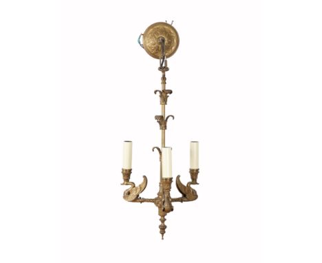 AN EMPIRE STYLE GILT-BRONZE THREE LIGHT CHANDELIER20th Century
With swan arms supporting candle nozzles about an acanthus kno