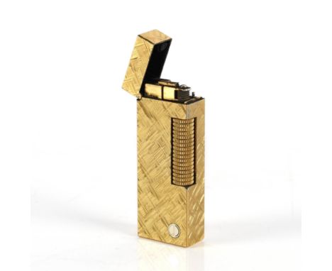 ALFRED DUNHILL LTD.: A GOLD PLATED ROLLAGAS POCKET LIGHTER6.5cm high, together with two booklets