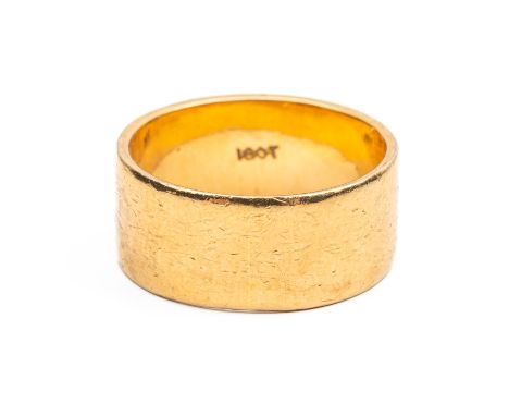 A 18CT  WEDDING BANDMeasuring 8mm and stamped 18ct, size K½, gross weight 7 grams