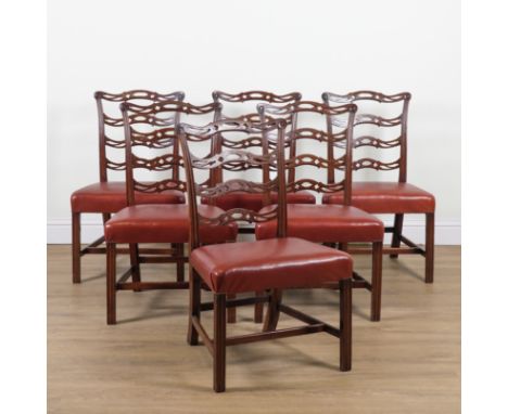A SET OF SIX GEORGE III MAHOGANY PIERCED WAVY LADDER BACK DINING CHAIRS (6)With leather upholstered seats, 56cm wide; 93cm hi