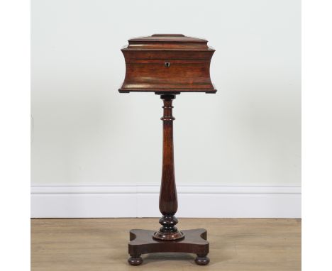 A WILLIAM IV ROSEWOOD TEAPOYOn turned column over quatrefoil base, 37cm wide; 21cm deep; 80cm high
