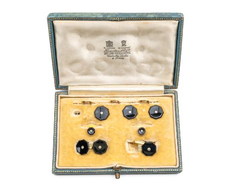 A BLACK ONYX AND DIAMOND PART DRESS SETComprising; three buttons, with three split ring fittings, one and a half pairs of cuf