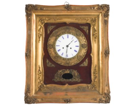 A FRENCH NAPOLEON III GILT METAL MOUNTED WALL CLOCKCirca 1870 
With enamel dial blue painted Roman hours, twin-train movement