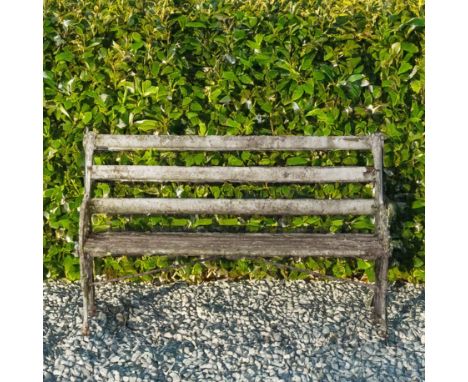 A WHITE PAINTED CAST ALUMINIUM GARDEN BENCHWith foliate pierced roundels, 150cm wide; 91cm high