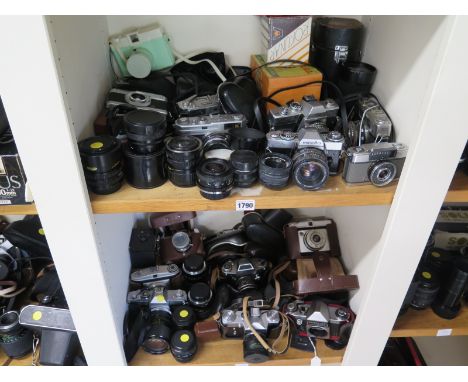 A quantity of camera bodies and lenses including vintage cameras - makes include Minolta, Rank Aldis, Canon, Olympus Pen-EE P