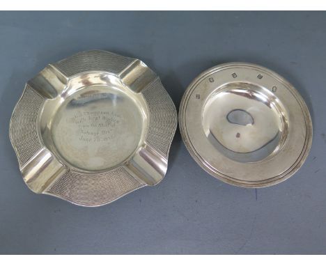 A silver hallmarked ashtray with engraving to centre and engine turned finish to rim, a silver hallmarked armada dish, ashtra