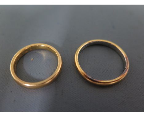 A 22ct yellow gold wedding band and a 22ct yellow gold and platinum wedding band - approx 8 grams - ring size K and P/Q