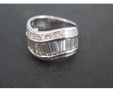 An 18ct white gold diamond ring - total diamond weight approx 2.3ct, baguette and small square cut - approx weight 9.5 grams 