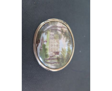 A 19th century enamel brooch with Country House scene, in a gilt metal mount - 35mm x 45mm 
Condition report: Cracks and chip