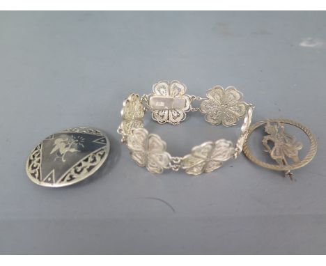 Two Eastern silver brooches and a bangle - Total weight approx. 1 troy oz