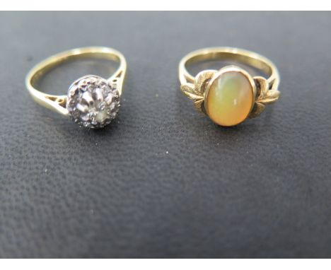 An 18ct gold ring set with an oval fire opal cabachon cut measuring approx 9mm x 7mm - ring size L together with an 18ct gold