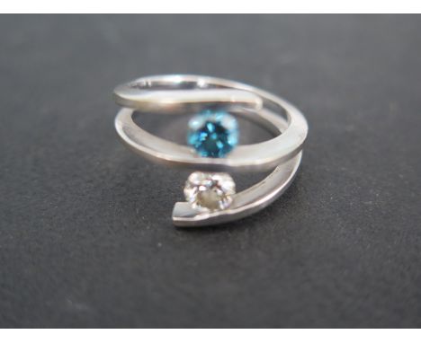 A 14ct white gold ring with blue and white diamonds to shoulder size M/N - blue diamond with inclusions - approx size 1/2ct p