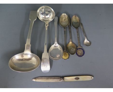 A small quantity of hallmarked silver flatware including a toddy ladle, a fiddle back ladle, a jam spoon, two souvenir spoons