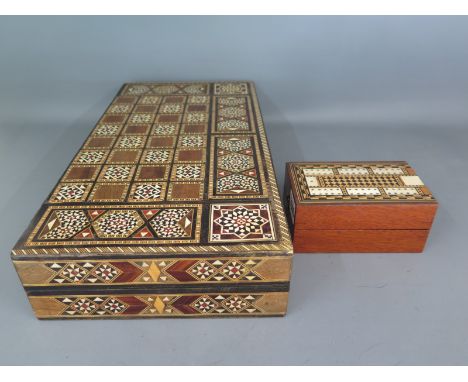 An inlaid Cribbage board and cased set of double nine bone Dominoes possibly Napoleonic French Prisoner of War, an inlaid Che