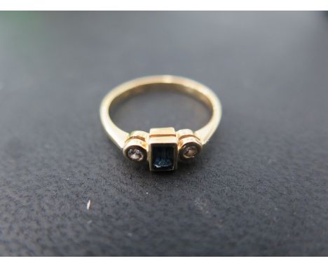 An 18ct diamond and sapphire - Ring size J - Weight approx. 2 gms 
Condition report: Stones bright, some usage but clean cond