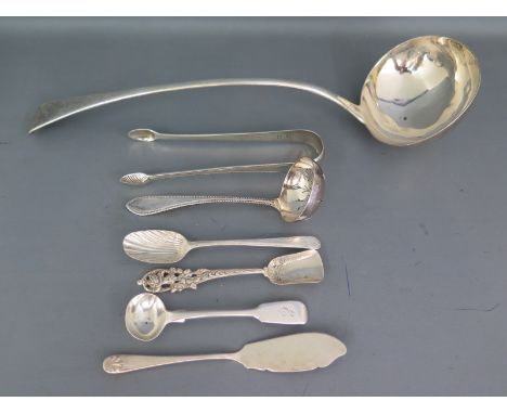 A silver hallmarked ladle London 1822-23, a silver hallmarked tea strainer ladle Sheffield 1900-01, a pair of sugar nips and 