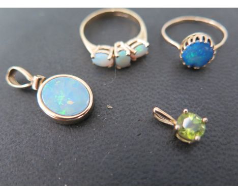 A 9ct gold three stone opal ring, a single blue opal set ion a gold and silver mount, an opal and diamond pendant and a 9ct g