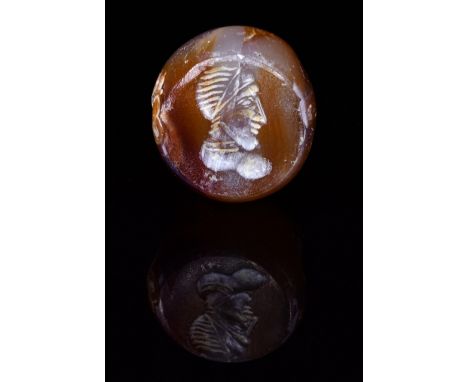 C. 224 to 651 AD. Sassanian.A beautiful Sassanian carved seal bead featuring a portrait of a man in profile wearing an elabor