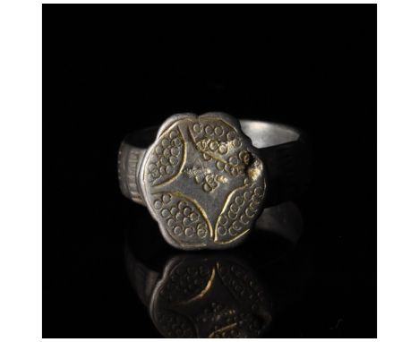 c. 1000-1500 AD, Crusader Period. Silver ring with a thick circular hoop and a hexagonal bezel featuring an incised Star of B