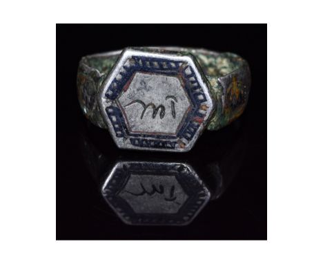 C. 1500 AD, Persian. Silver ring with D-shaped hoop and hexagonal bezel. The shoulders of the hoop bear buta designs and the 
