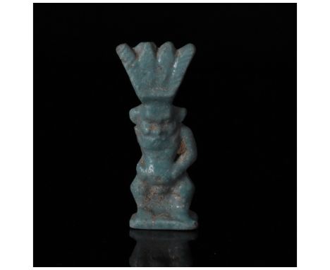 712-30 BC, Late Period/Ptolemaic. A beautiful light blue Bes amulet depicting the god as a grotesque, bearded dwarf, with a m