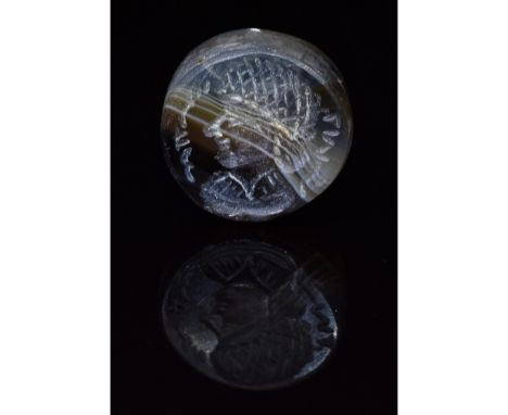 C. 224 to 651 AD. Sassanian. A beautiful Sassanian carved seal bead bearing a portrait of a man wearing a crosshatched head-c