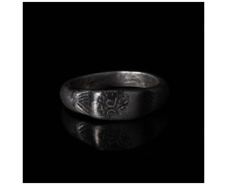 1-300 AD, Roman. Silver ring with circular hoop, shoulders with incised chevron decoration and raised, rectangular bezel with