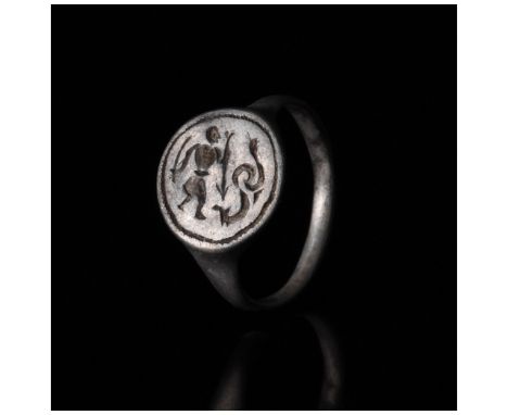 c. 1000-1100 AD. Viking age. A beautiful silver ring with a circular hoop and round bezel bearing incised decoration in the f