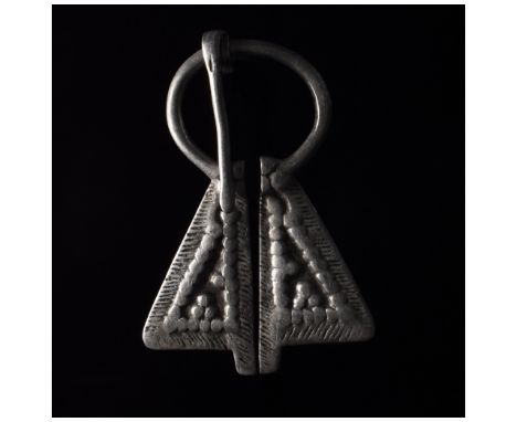Ca. 700- 1100 AD. Viking Era. A fine silver penannular brooch with flaring terminals decorated with raised dots arranged in g