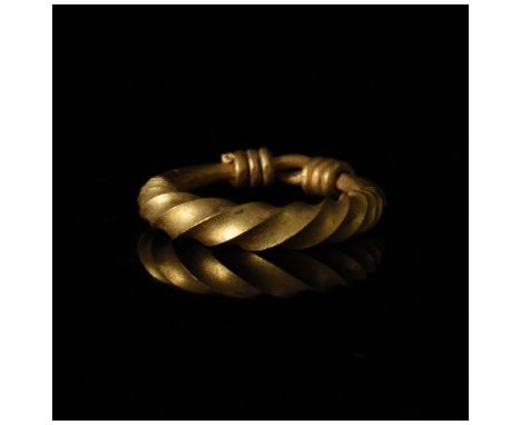 700-1100 AD, Viking Age. A superb heavy gold ring is comprised of a twisted band with wrapped terminals. This ring was intend