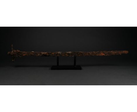 700-1000 AD, Viking Age. An iron sword with a long, single-edged blade, culminating in a point and a rectangular guard. The s