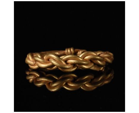 Ca.900 AD An attractive Viking gold finger Ring formed by multiple tapering rods twisted together. Good Condition; wearable; 