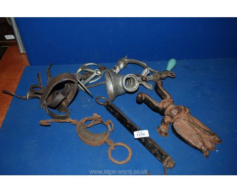 A quantity of miscellanea including part leather bridle and bit, beetle boot Jack, old mincer, scales, etc.