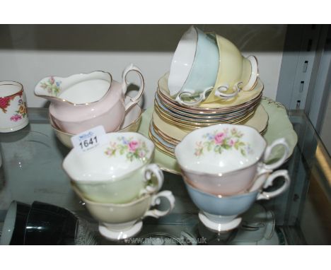 A Royal Albert vintage part Teaset comprising six each cups, saucers, tea plates, plus milk jug, sugar bowl and cake plate, i