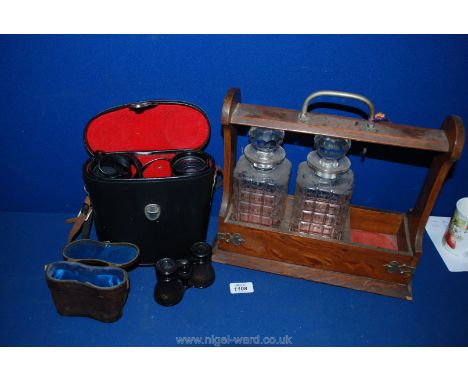 A Tantalus with two decanters, a pair of Prinzlux Spacemaster 7 x 50 Binoculars and a pair of Opera glasses in case.