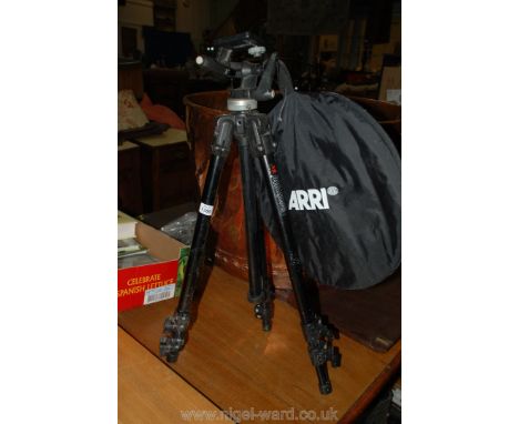 A Manfrotto 144 Italian made professional Tripod together with a 115 adjustable head, Amy photographic reflector and case.