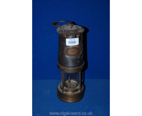 An old Brass Davey Lamp by Patterson Lamps Ltd., Gateshead-on- Tyne, no. 65, 9 1/2'' tall.
