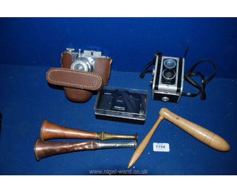 An Italian Koroll Camera, two copper hunting Horns and an old turned wood Rattle