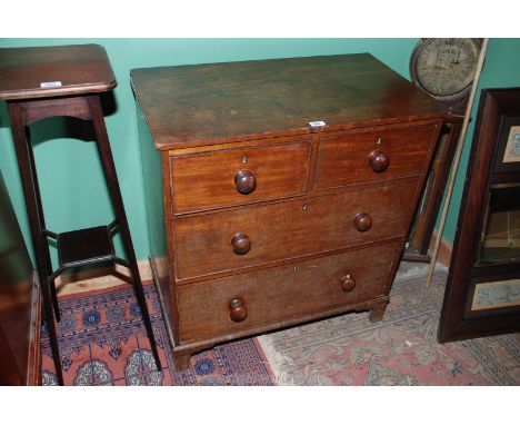 A small Victorian Mahogany Chest of two short over two long graduated Drawers, having rectangular top over the four plain fro